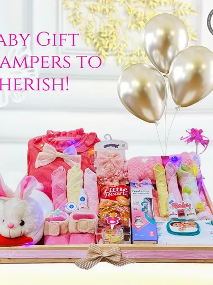 Baby gift hampers to cherish. This adorable pink hamper with a plush bunny is the perfect gift for a baby shower or to congratulate new parents.