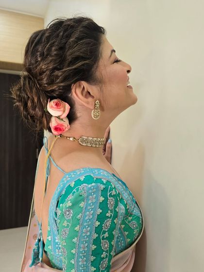 Another view of the beautiful floral hairstyle, showing how it enhances the overall look from every angle.