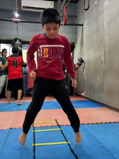 Fitness is the foundation of a good fighter. We use agility ladder drills like these to improve footwork, speed, and coordination, making our workouts a full-body experience.