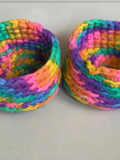A pair of my rainbow storage baskets. They are great for keeping your small essentials tidy and easy to find.