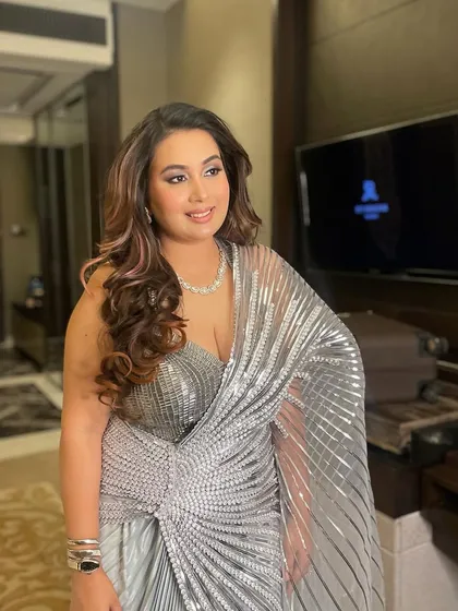 Soft curls with beautiful highlights, a classic look for a glamorous reception or cocktail party.