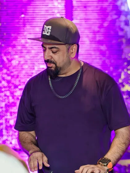 In the zone at Kaze, mixing tracks under the purple lights.