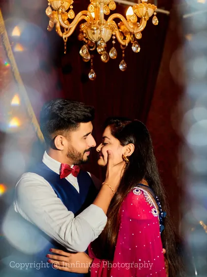 We use creative techniques like shooting through a crystal to create beautiful bokeh and light effects, adding a touch of magic to this close-up romantic portrait.