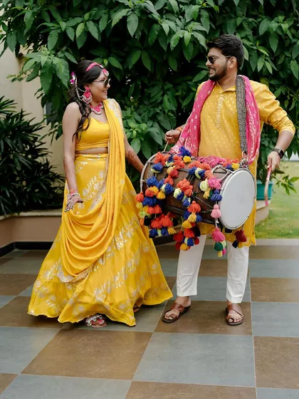The energy of a Haldi ceremony is contagious! We love seeing our couples, like Sukriti and Rahul, have the time of their lives, complete with dhol players and colorful decor that matches their joyful spirit.
