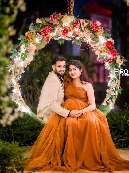 A beautiful maternity portrait on our floral swing, with the warm evening lights creating a magical glow.
