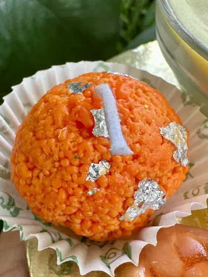 A close-up of a single Boondi Laddoo candle, a perfect little piece of joy to light up your festive season.