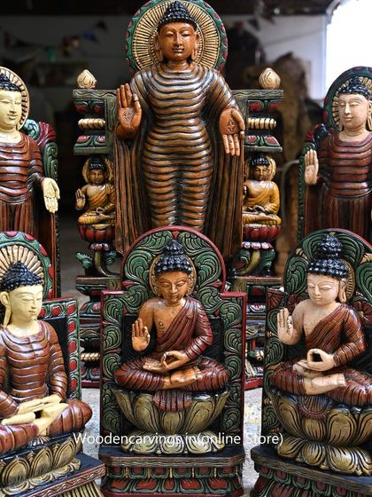 A central view of our colorful Buddha collection, with a large standing Buddha surrounded by smaller seated figures.