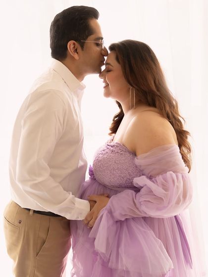 A soft forehead kiss speaks volumes. This intimate portrait from a Pune studio session captures the quiet love and support between partners.