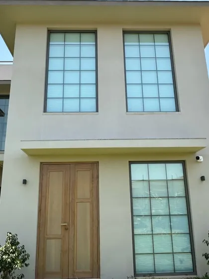 This building facade features our system windows with Georgian bars, complementing the classic design of the home. We ensure our windows match the architectural style perfectly.