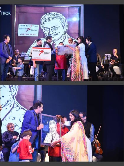 On stage, presenting the framed portrait of the late Madan Mohan to his son, Mr. Sameer Kohli. This happened at a concert organized in memory of his iconic songs.