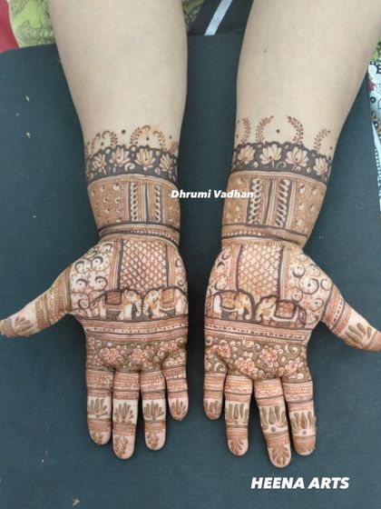 A lovely design done by my team, featuring small elephants marching along the wrist, a popular and auspicious motif.