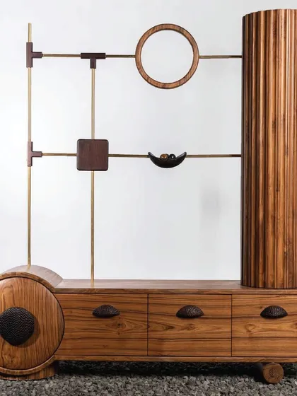 I believe furniture should be art. This unique TV unit is a testament to that philosophy, combining geometric forms like circles, squares, and cylinders in solid teakwood and brass. It’s a functional sculpture that provides storage while being a conversation starter.