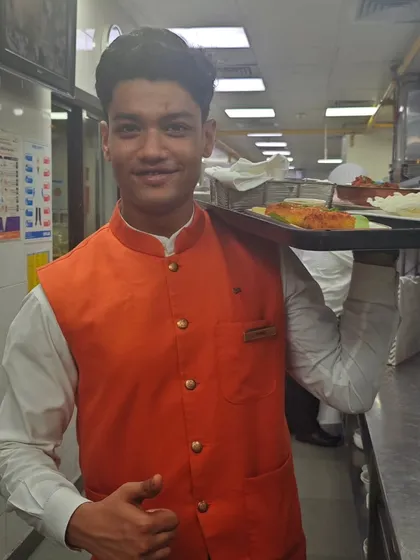 A member of the service staff at The Lodhi, New Delhi, carrying a tray of our Maharashtrian food. The gracious and enthusiastic service team played a huge role in making our pop-up a success.
