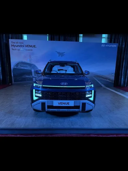 A frontal shot of the all-new Hyundai Venue on display. We ensured the lighting and stage setup highlighted the vehicle's bold design features during the media launch.