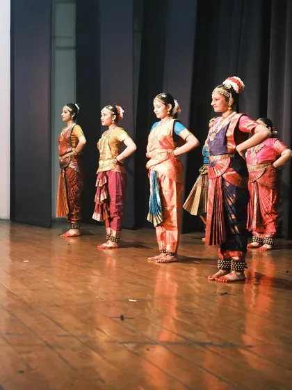 My senior students in formation during a recent performance at the Ayyappa Swamy Temple. Their discipline and hard work are evident in their poised presence on stage.