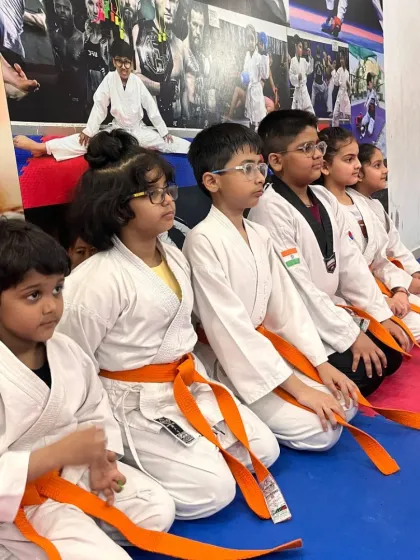 Students sitting in seiza, listening with focus and respect. Discipline is the first lesson taught in our dojo, even before the first punch.