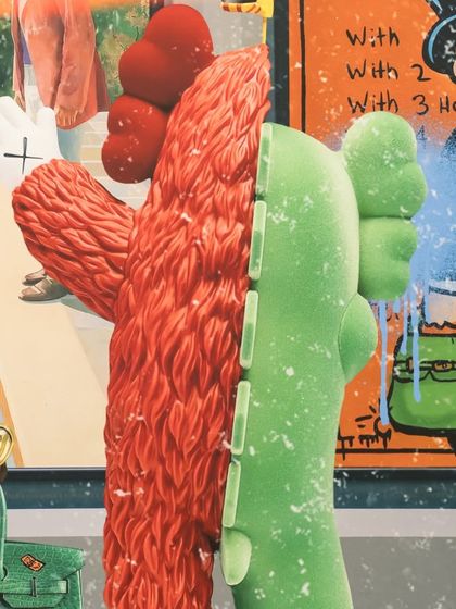 A close-up on the KAWS-inspired figures in "The Museum Heist," showcasing the textured and layered details of the mixed-media piece.