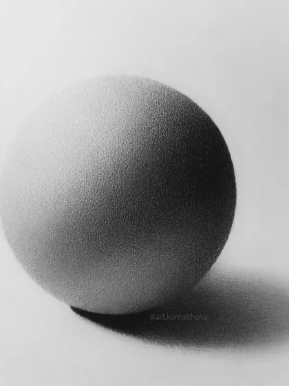 A study of a matte sphere. This exercise helps you understand how to create a soft, non-reflective surface texture using only pencil strokes.