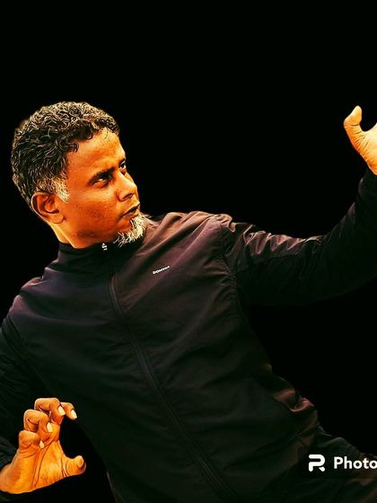 An edited photo capturing the intensity and hand positions of a combat stance.