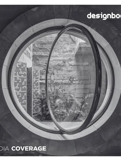 Our House of Solid Stone project was featured in Designboom. The photo shows a unique pivoting circular window set within a heavy stone wall, a playful yet precise detail.