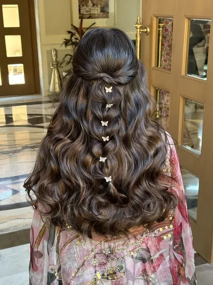 This hairstyle is pure grace and beauty, with soft curls and fluttering butterflies.