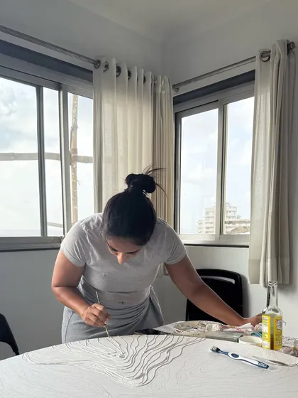 My studio, with the sea just outside the window, is my sanctuary. Here I am, deep in the process of creating, with the natural light guiding my work.