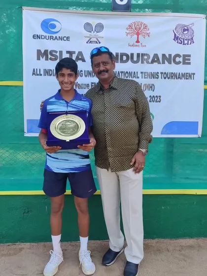 Tavish receiving his singles trophy at the U14 Nationals in Aurangabad.