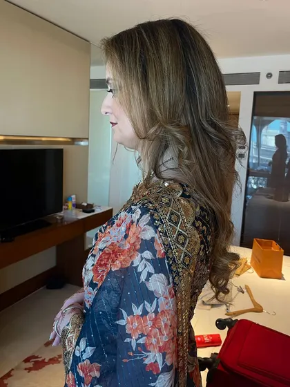 A side profile showing the soft, flowing curls I created for Sonya's hair.