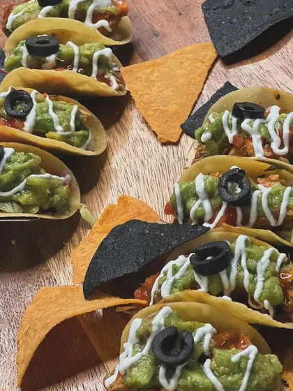 Mini tacos loaded with fresh guacamole, salsa, and a drizzle of sour cream. These bite-sized treats are perfect for parties and are always a crowd-pleaser.