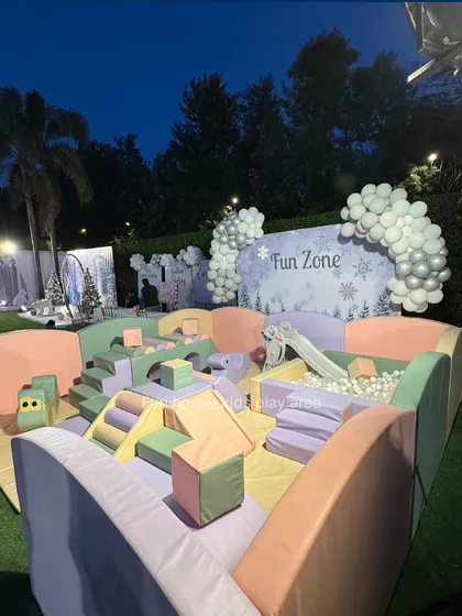 Our Pastel Dream setup looks magical, especially for evening events. This outdoor configuration features a ball pit, slide, and soft play blocks in gentle colors, creating a picture-perfect fun zone for any celebration.