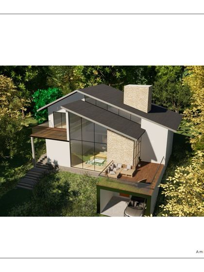 An aerial view of The Ridgeway Escape in Coorg, showing how the rooflines and terraces are integrated into the sloping hillside. The design works with the topography of the land, not against it.