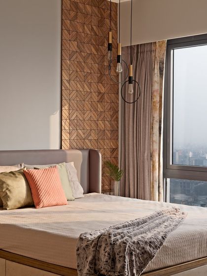 A different angle of the bedroom, showing how the morning sun highlights the texture of the wooden wall panel.