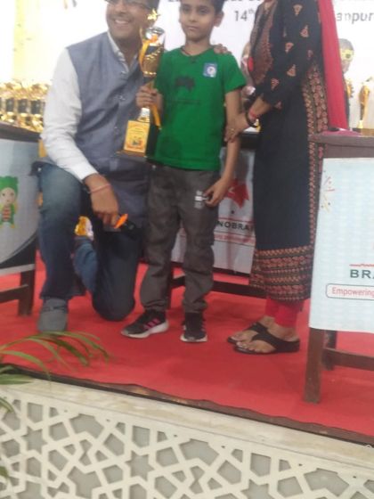 Another one of our champions receiving his trophy on stage. These award ceremonies are a powerful way to acknowledge hard work and motivate students to aim even higher.