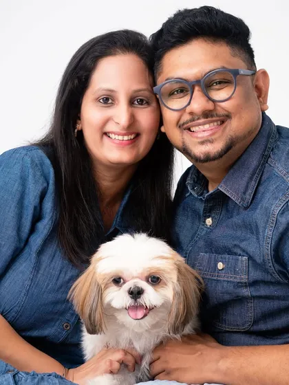 A couple and their fur baby. For many, pets are their first "children," and a portrait session is a wonderful way to celebrate that bond.