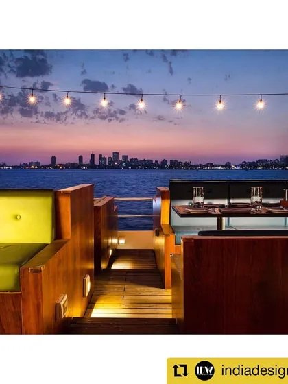 Seating alcoves on the deck offering a direct, uninterrupted view of the Mumbai skyline. The design prioritizes the connection to the surrounding sea and cityscape, making it an integral part of the guest experience.