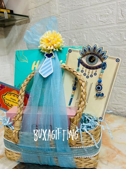 A slightly different angle of the blue Rakhi hamper, showing all the elements neatly packed.