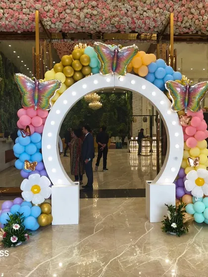 A different view of the lighted entrance arch, showing how it creates a magical entryway for guests arriving at the party.