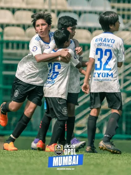 A successful team is not only a group of many hands and feet, but of one mind. A team celebration after a goal.
