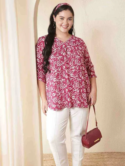 I believe in versatile pieces, like this comfortable plus-size printed top. It pairs beautifully with simple white trousers for a chic, casual ethnic look that’s perfect for work or a day out.