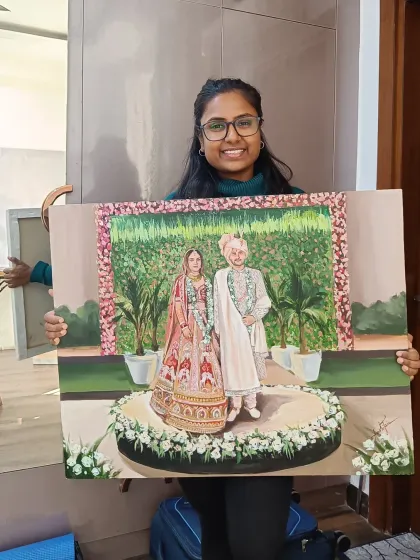 Holding up the completed live wedding painting. It gives a great sense of the size and detail of the final artwork.
