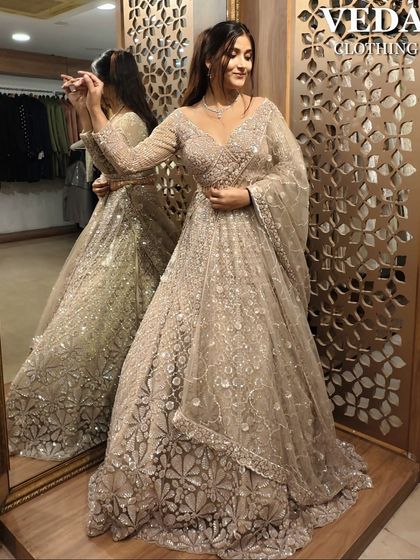 This beige sequin lehenga looks stunning from every angle. The mirror shot shows off its beautiful fit and sparkle.