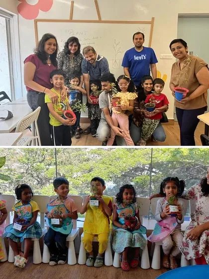 Proud parents and children pose with their finished pots at the end of the gardening workshop, a perfect community moment.
