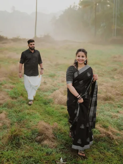 A lovely candid shot of her walking ahead, looking back at him with a smile.