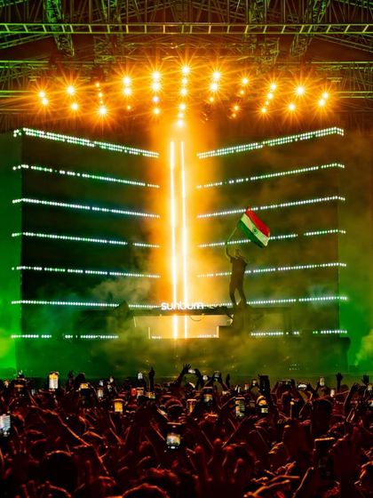A massive LED screen backlights the stage with the Hungarian flag colors as Dimitri Vegas & Like Mike perform.