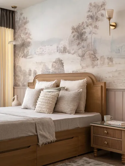 A closer view of the bed with its arched headboard and layered neutral bedding, creating a cozy and inviting atmosphere against the backdrop of the hand-painted mural.