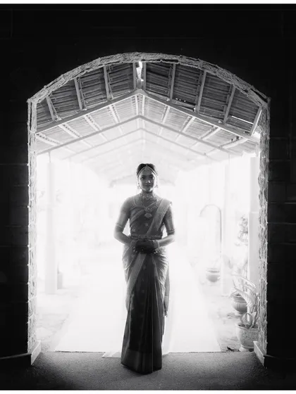 A bride's quiet anticipation. I framed Mohita in this archway, using the dramatic light to create a timeless, fine art bridal portrait that feels both powerful and serene. This is where photography becomes artwork.