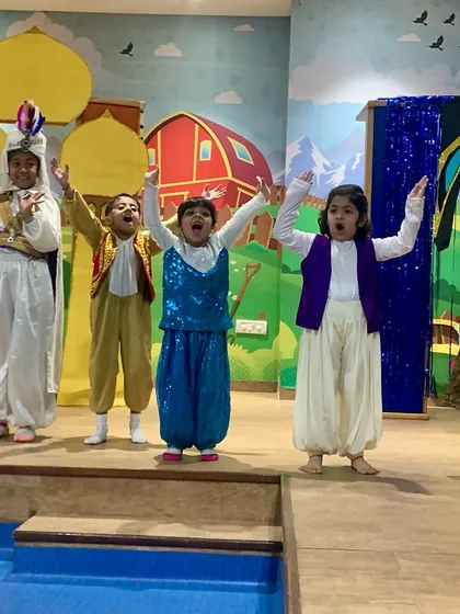The cast strikes a final, triumphant pose. Participating in a theatre show builds immense confidence and creates a wonderful sense of accomplishment for every child.