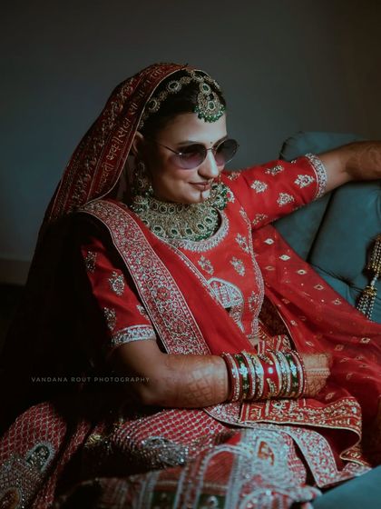 A fun, candid shot of the bride looking cool and relaxed in her sunglasses. This shows the blend of traditional and modern moments I love to capture.