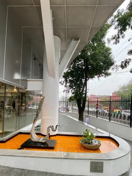 Another view of the entrance water feature at MAP, showing the relationship between the sculpture, the tree-like column, and the street.