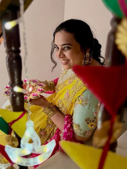 A close-up shot of me with diyas during Diwali. This beautiful, traditional photo captures the essence of the festival of lights and showcases my ability to create aesthetic, culturally relevant content.